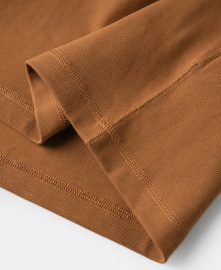 Long-sleeve henley shirt sleeve cuff and stitched hem in orange