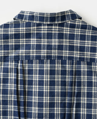 Blue plaid work jacket back with high collar and pleated yoke
