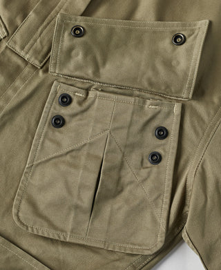 Khaki green paratrooper jacket front pocket with buttoned flap and riveted details