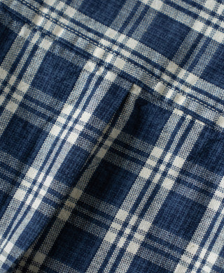 Blue plaid shirt jacket fabric close-up with check stripes