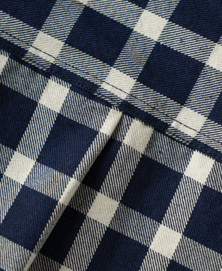 Navy and white plaid work jacket fabric with stitched seam detail