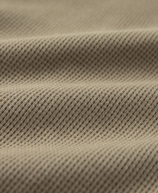 Khaki waffle knit jogger fabric texture close-up