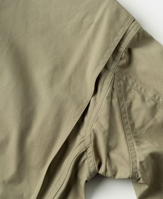 Khaki flight jacket sleeve with cuff seam and pocket opening detail