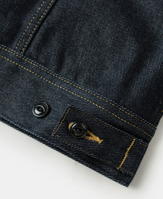 Indigo denim jacket cuff hem with two dark buttons and yellow stitch detail