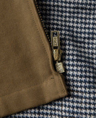 Brown cossack jacket zipper tag hardware on houndstooth lining