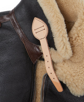 Dark brown leather flight jacket with tan shearling collar and tab detail