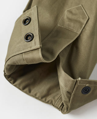 Khaki green M-42 jacket sleeve cuff with metal grommets and button closure
