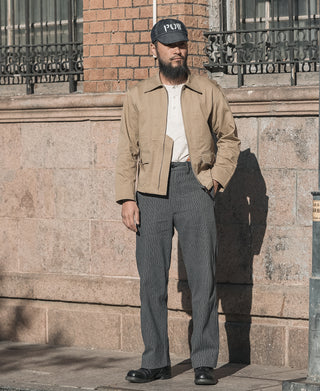 Khaki summer flight jacket with zipper front and flap chest pockets over white tee