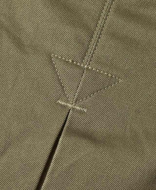 Khaki green paratrooper jacket shoulder yoke with stitched triangular reinforcement