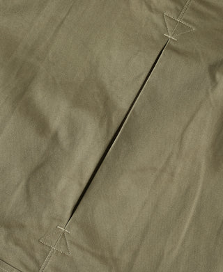 Khaki green paratrooper jacket sleeve with diagonal stitched seam and triangular marking