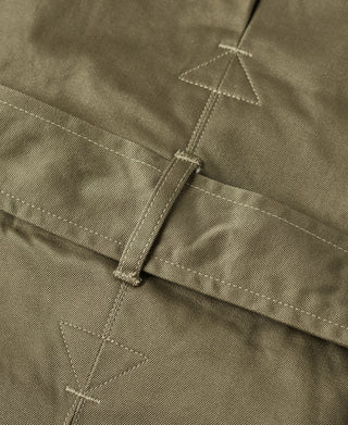 Khaki green paratrooper jacket cuff/side strap with vertical tab and stitched triangles