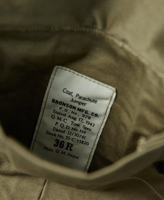 Khaki green jacket interior label stitched inside the coat lining