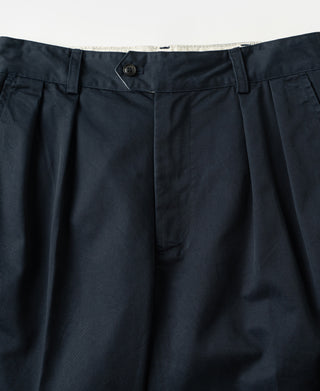 Navy trousers front with pressed creases and pleated front detail