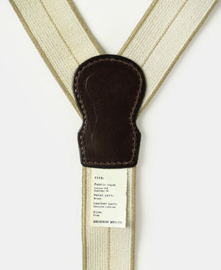 Y-back button-on suspender leather patch with white care label
