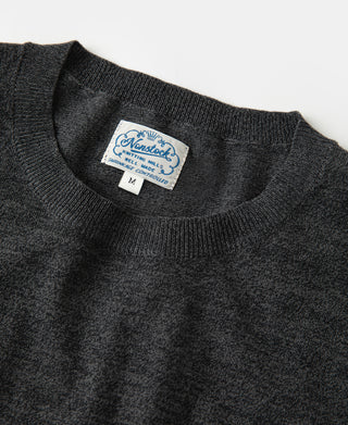 Dark gray jersey knit T-shirt with ribbed crewneck and collar logo tag
