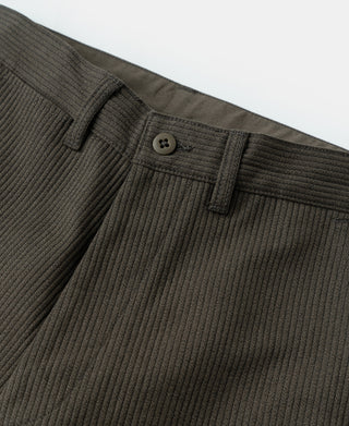 Waistband view of cotton work trousers with button closure and vertical pique stripe.