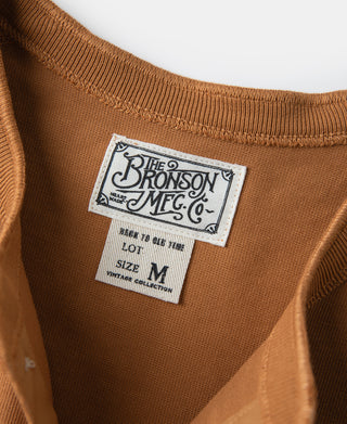 Vintage long-sleeve henley shirt tag: THE BRONSON MFG. CO. size M in dark orange