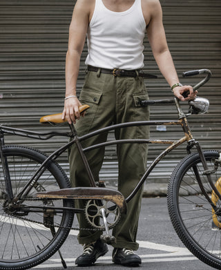 Brown leather belt with brass buckle on waist