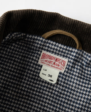 Houndstooth lining at cossack jacket collar with brand tag and size label