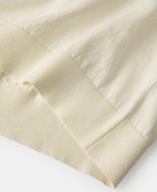 Light cream jersey knit sleeve cuff and ribbed hem with stitched seam detail