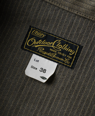 Size label on dark olive striped cotton Cossack jacket, marked "Size 38"