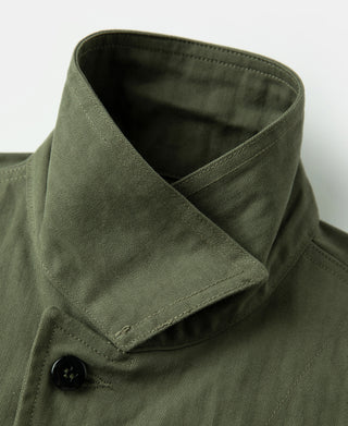 Olive jacket inner collar with black button closure