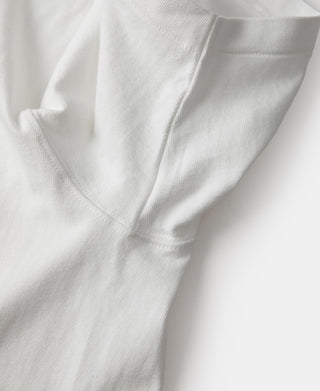 White tubular athletic t-shirt underarm seam detail with smooth stitching.