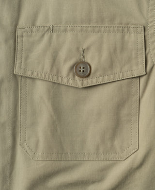 Khaki flight jacket chest pocket with button and stitched pocket outline