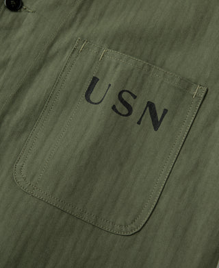 Olive jacket front patch pocket with USN lettering