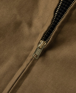 Brown cossack jacket zipper with metal pull tab and dark inner facing