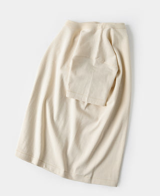 Light apricot athletic t-shirt shown from lower side with hem and seam