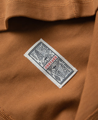 Vintage long-sleeve henley inner label: UNITE STATE/Care info on dark orange shirt