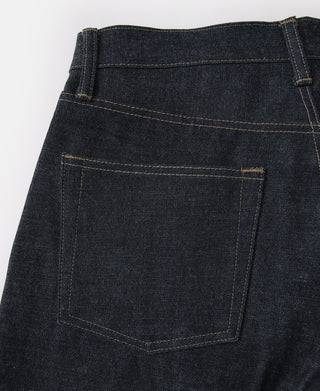 Indigo denim jeans back view with single back pocket and contrast stitching