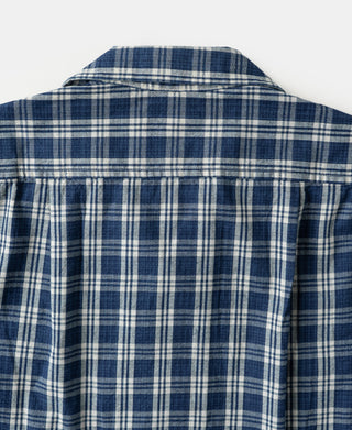 Blue plaid shirt jacket back yoke seam with pleated panel detail