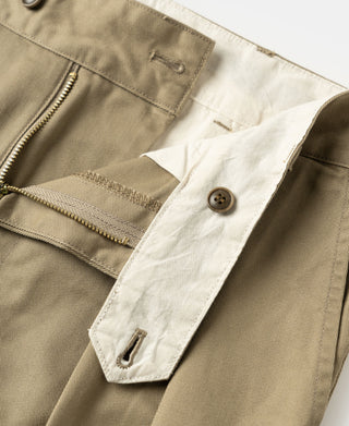 Khaki trousers interior waistband with button and stitched pocket lining.
