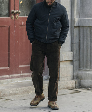 Navy deck jacket with full-length zipper and front slash pockets, worn by model
