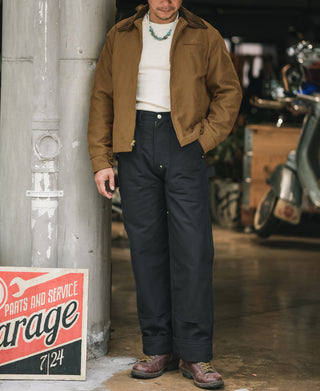 Man wearing brown cossack jacket with white shirt and dark pants